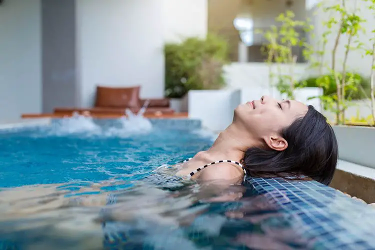 Woman enjoy and relaxing on jacuzzi spa