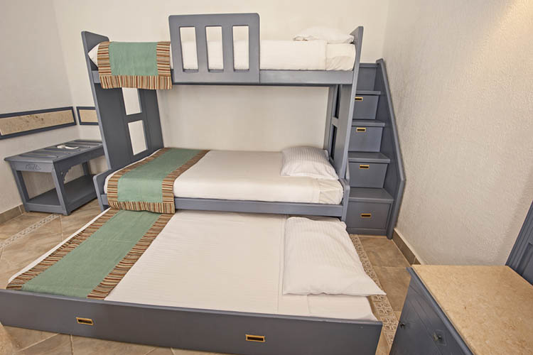 Space saving bunk beds in family bedroom storage concept idea with steps