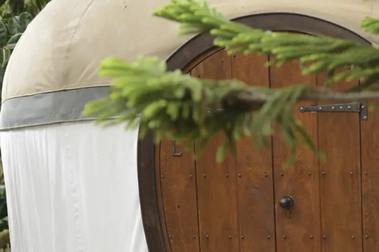 Banner with detail and yurt door with tree