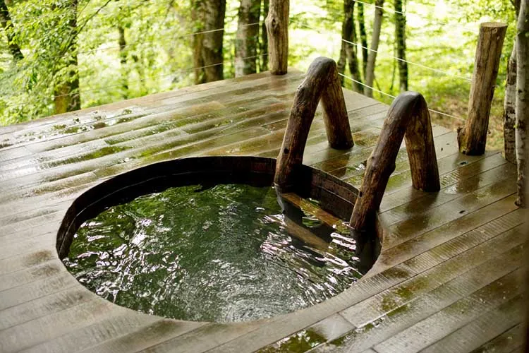 Wooden hot tub outdoors Photo